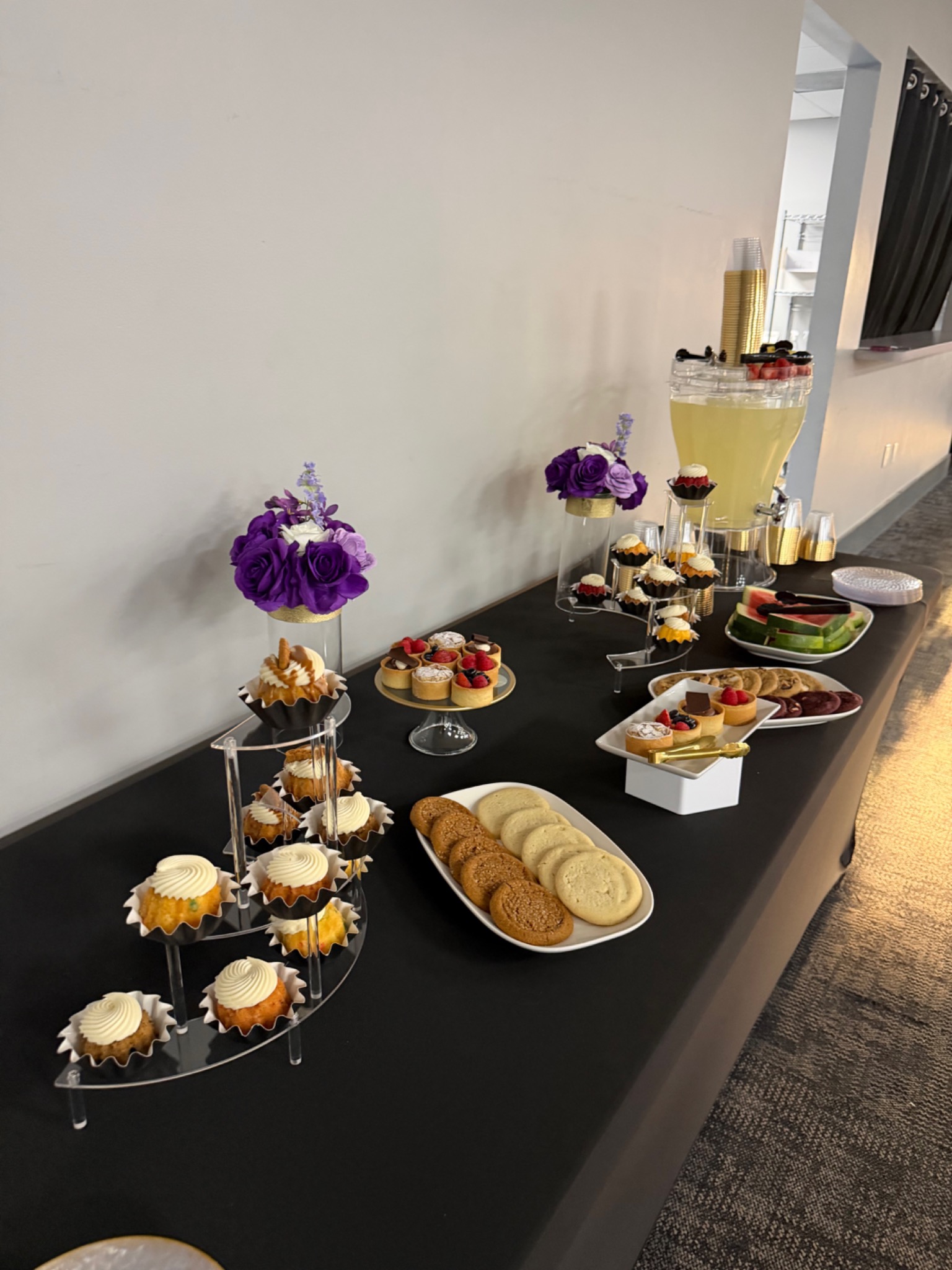 Dessert and refreshment display prepared for a Two Chics Catering event