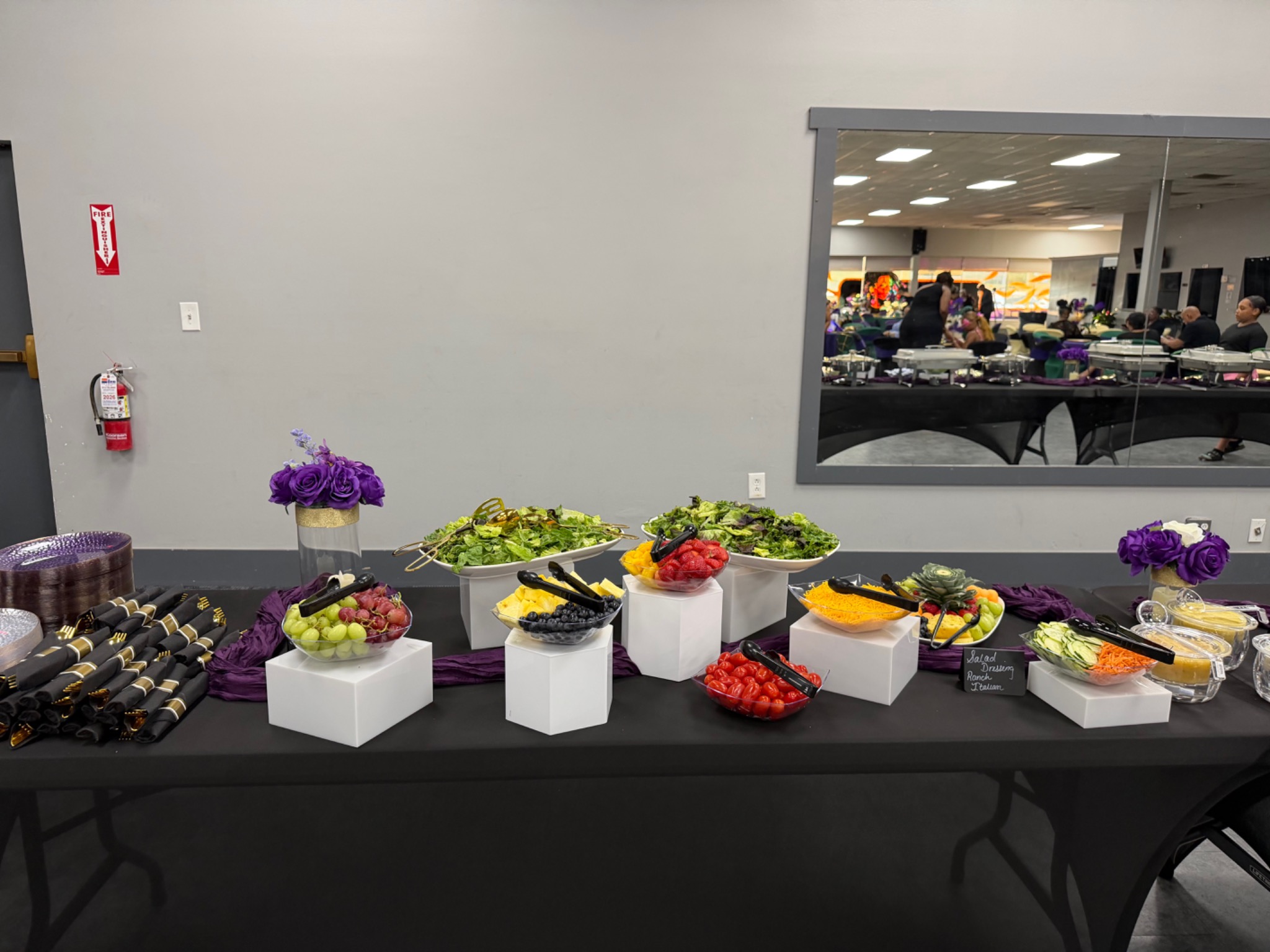 Fresh salad and fruit buffet arranged for a Two Chics Catering event